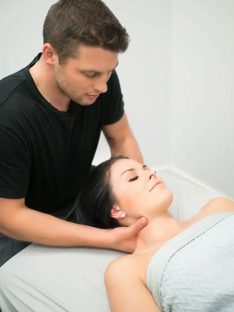 Tom Kerswell, Registered Massage Therapist in Duncan BC, treating a client's neck